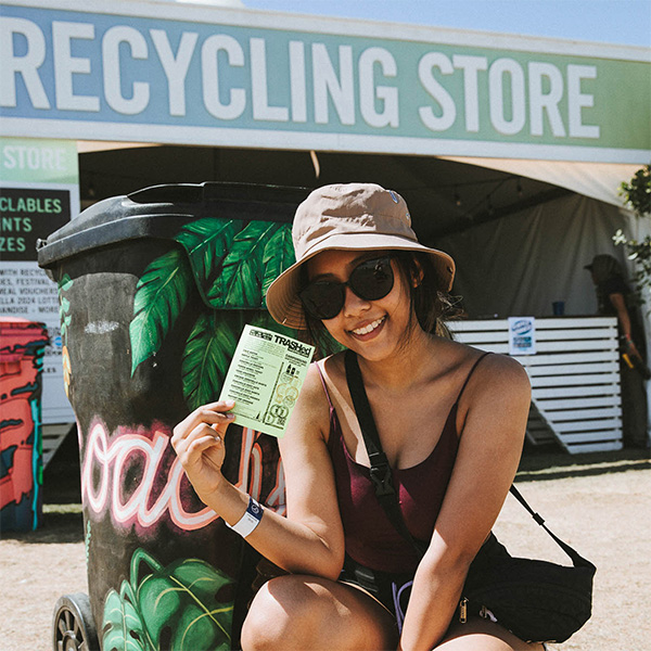 Coachella fan in front of Recycling Store