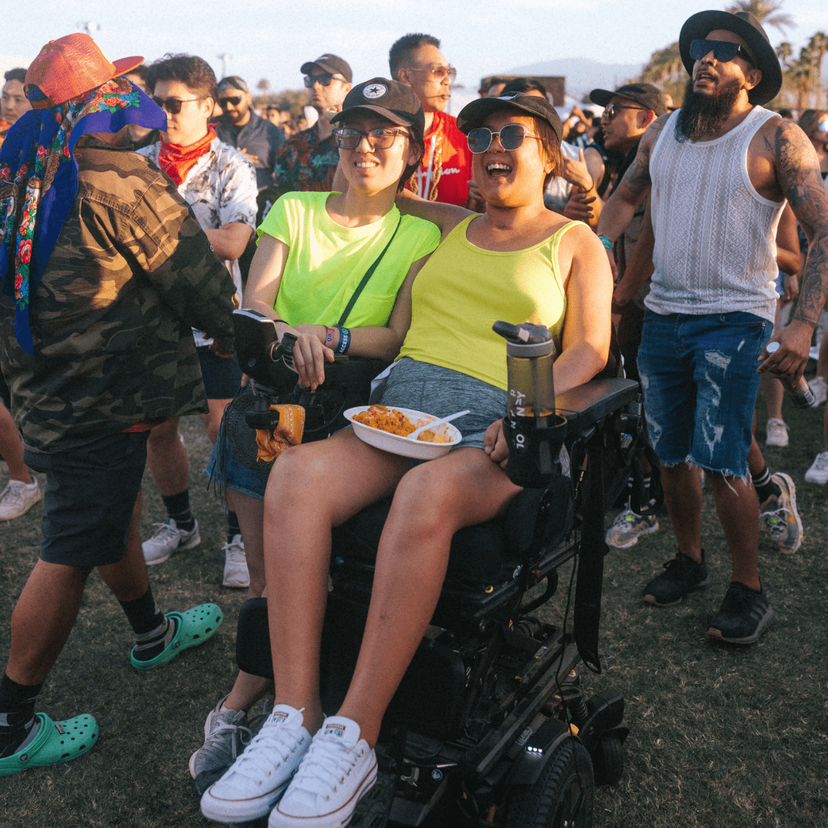 Coachella fan in wheelchair watching a show
