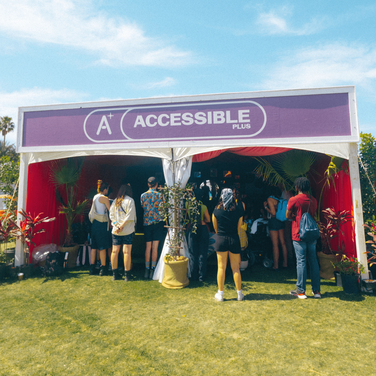 Photo of fans standing in Accessible+ tent