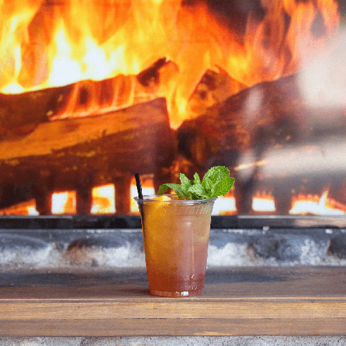 cocktail featured in front of a fireplace