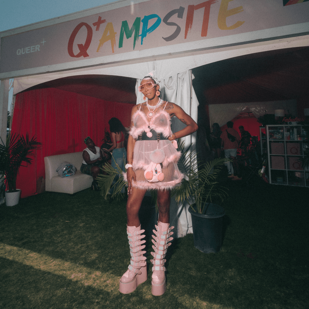 Coachella fan standing in front of Queer+ tent