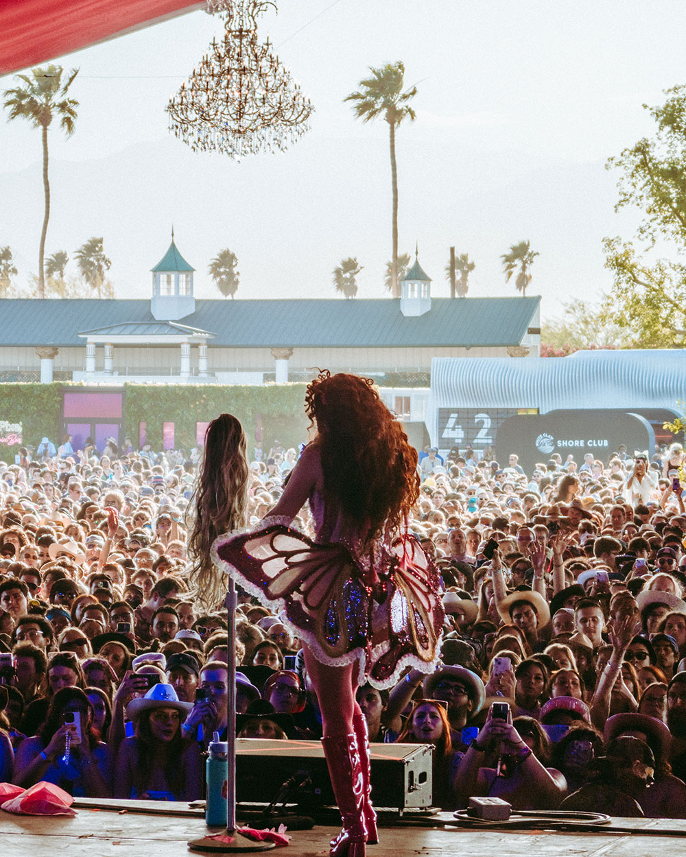 Coachella performer in front of crowd taken from backstage